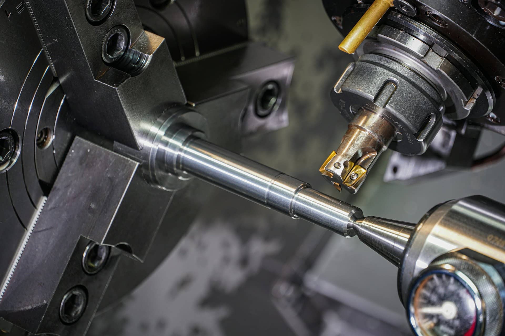 A metal part being machined on a lathe